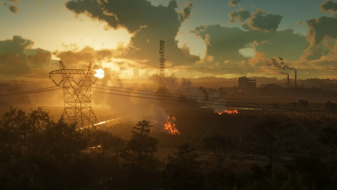 Power lines and smoke over the Ambrosia countryside at sunset