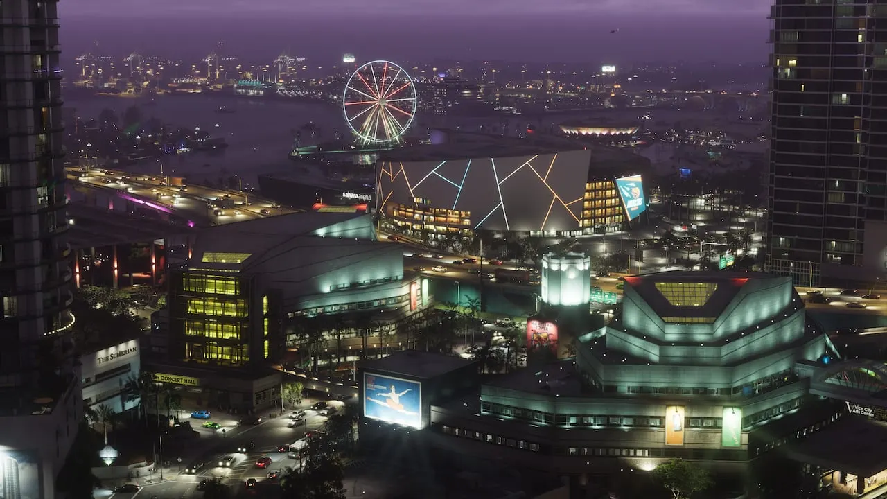 Vice City's arena and waterfront lit up at night, a Ferris wheel behind